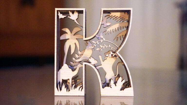 Letter K | Leeuw & dromedaris